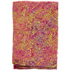 A folded piece of fabric with a bright pink background and a yellow and green leaf-like pattern.