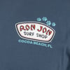 Close-up of a blue Ron Jon Surf Shop t-shirt with paw prints and text Cocoa Beach, FL printed below the logo.