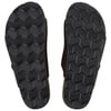 The image shows the black treaded soles of a pair of flip-flops, viewed from below.