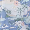 A detailed pattern of tropical scenery on fabric, depicting palm trees, flowers, waves with a surfer, sailboats, and clouds against a blue background.