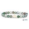 A beaded bracelet with green and white marbled beads and a central bead shaped like an koala, shown next to the Fahlo logo.