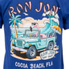 Illustration of a flamingo driving a teal car with a surfboard and umbrella on the beach, with Ron Jon Surf Shop and Cocoa Beach, Fla text on a blue t-shirt.