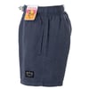 Dark blue knee-length swim shorts with a drawstring waist. A tag with The Endless Summer graphically depicted is attached. A small logo patch is near the bottom hem.