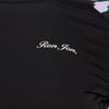 Close-up of a black garment with Ron Jon written in small white text.