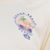 Cream-colored garment with a circular logo featuring palm trees and a sunset, labeled Cocoa Beach Florida and Ron Jon Surf Shop.
