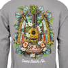 Gray shirt with a colorful graphic of a pineapple ukulele, surfboards, tropical flowers, and leaves. Text reads Ron Jon Surf Shop and Cocoa Beach, Fla.