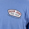 Close-up of a blue t-shirt featuring a Ron Jon Surf Shop logo with Long Beach Island, NJ written below in black text.