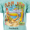Cartoon kangaroo and shark play beach volleyball while an iguana watches, with surfboards and palm trees in the background. Text reads Ron Jon Surf Shop, Cocoa Beach, Fla.