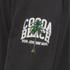 Logo on fabric showing a coconut tree with COCOA BEACH and RON JON SURF SHOP in white letters.