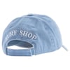 A light blue baseball cap with SURF SHOP embroidered in white on the back above an adjustable strap.