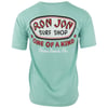 Back view of a sea foam T-shirt featuring a large Ron Jon Surf Shop logo and the text One of a Kind, Cocoa Beach, Fla.