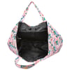 A large, open duffel bag with a colorful tropical print and black interior lining, showing spacious inner compartment and shoulder straps.