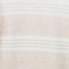 Close-up of a light brown and white striped sweater, showing the texture and horizontal stripe pattern.
