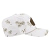 White baseball cap with beige tropical leaf and fish patterns, featuring a brown patch on the side.