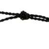 Close-up of a black braided cord tied into a knot, shown against a white background.