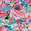 Colorful abstract floral pattern with pink, red, green, and blue hues.