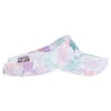 A colorful visor hat featuring a pattern of sea turtles in pastel shades of purple, pink, and teal.