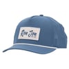 Blue mesh snapback hat with a white rectangular patch on the front that reads Ron Jon Surf Shop in blue script.