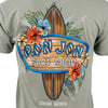 Green t-shirt featuring a surfboard design with tropical flowers and Ron Jon Surf Shop Cocoa Beach text.