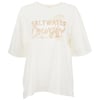A white t-shirt with short sleeves featuring the text Saltwater Cowgirl and a palm tree graphic in beige on the front.