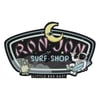 A Ron Jon Surf Shop sign with an illustrated moon, stars, an alien, and an astronaut holding a surfboard; text reads LITTLE BOX GUY® at the bottom.