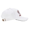 White baseball cap with a rectangular embroidered patch on the front and an adjustable strap with a metal buckle at the back.