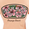 Logo on a peach background with pink hibiscus flowers, reading Ron Jon Surf Shop. Below, it says Orange Beach.