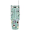 A light green travel tumbler with a handle, covered in colorful cartoon floral designs and characters, featuring a clear lid and a straw.