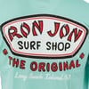 A close up of a back of a shirt with a Ron Jon Surf Shop The Original, Long Beach Island, NJ logo in red, black, and white on a seafoam background.