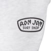 A close-up of grey pants with the black Ron Jon Surf Shop logo printed on them.
