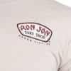 Close-up of a beige t-shirt with a Ron Jon Surf Shop, Ocean City, MD logo printed on the chest.
