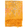 A folded yellow fabric with a purple and white floral pattern and fringed ends.