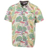 Short-sleeve button-up shirt with a colorful tropical leaf pattern on a white background.