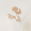 Close-up of a beige rooster graphic with the word Ron Jon on a light fabric.