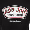Logo for Ron Jon Surf Shop with Cocoa Beach written below, printed on a black fabric background.