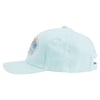 Light blue baseball cap with a patch on the front, shown from the side. The cap has an adjustable strap at the back.