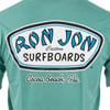 Green shirt with a large Ron Jon Surfboards logo and Cocoa Beach, Fla. text printed on the back in blue, black, and white.