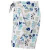 White swim shorts with a green, blue, and beige tropical leaf and abstract pattern, elastic waistband with drawstring, side pockets, and a round patch near the hem.