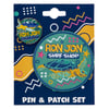 A Ron Jon Surf Shop pin and patch set featuring a sea turtle design and bold text on colorful, patterned packaging.