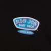 Logo of Ron Jon Surf Shop, Cocoa Beach, displayed on a black background.
