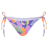 Colorful bikini bottom with a floral and leaf pattern, featuring side ties in orange, purple, and blue.