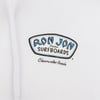 Close-up of a white garment displaying the Ron Jon Surfboards logo with blue text and Clearwater Beach underneath in black.
