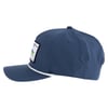 Side view of a blue baseball cap with a patch on the front panel and a white braided rope above the brim.