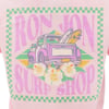 Back of a T-shirt with a colorful graphic showing a pickup truck carrying surfboards, hibiscus flowers, and text reading Ron Jon Surf Shop in large pink letters.