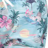 Light blue fabric with a tropical print featuring pink flowers, pineapples, palm trees, boats, a surfer, and a sunset over the ocean.
