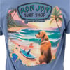 T-shirt with Ron Jon Surf Shop Cocoa Beach design featuring a dog, surfboards, and tropical beach scenery including palm trees and ocean waves.