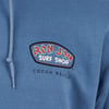 Close-up of a blue hoodie with the Ron Jon Surf Shop Cocoa Beach logo.