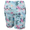 A pair of light blue swim trunks featuring a tropical print with palm trees, pink hibiscus flowers, sailboats, and islands.
