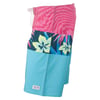 Colorful board shorts featuring a pink waistband, floral patterns, and blue color blocking.