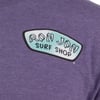 Purple shirt with an oval logo featuring Ron Jon Surf Shop in white and black letters on a teal background.